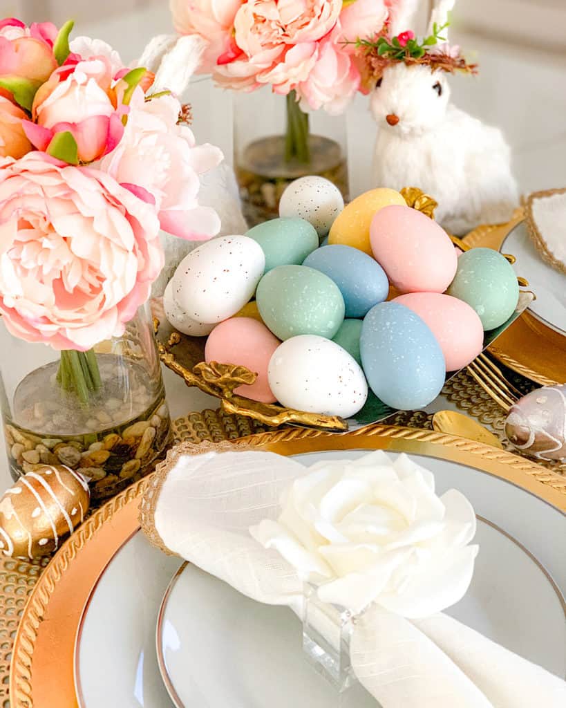 Handpainted eggs, bunnies and fresh flowers make a beautiful Easter table setting