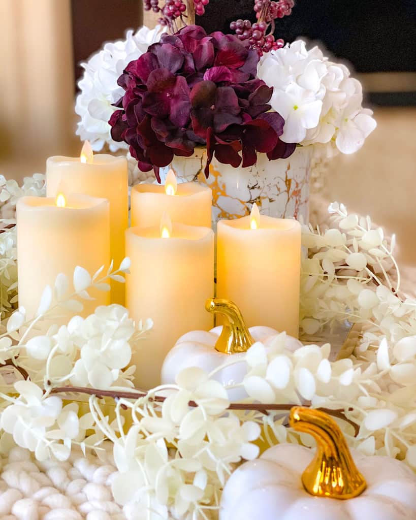 Fall themed white and red hydrangeas with candle display