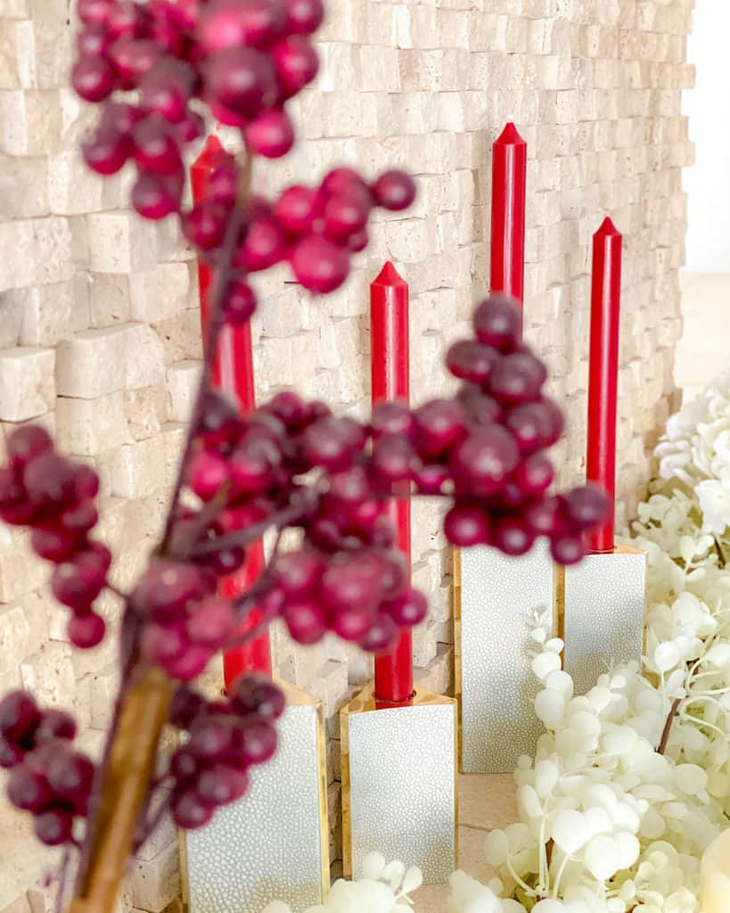 Styling your mantel for fall: candles and faux flowers in burgundy and white