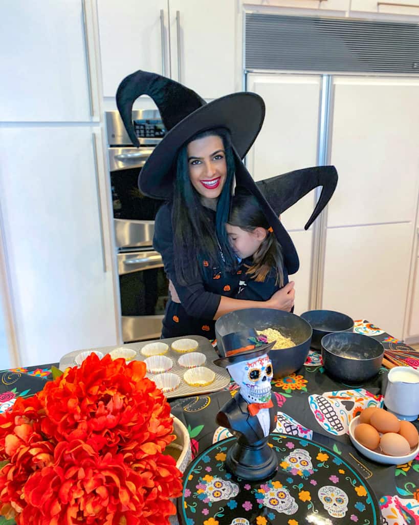 Halloween outfit cuddles in the kitchen with my daughter while we make Halloween desserts