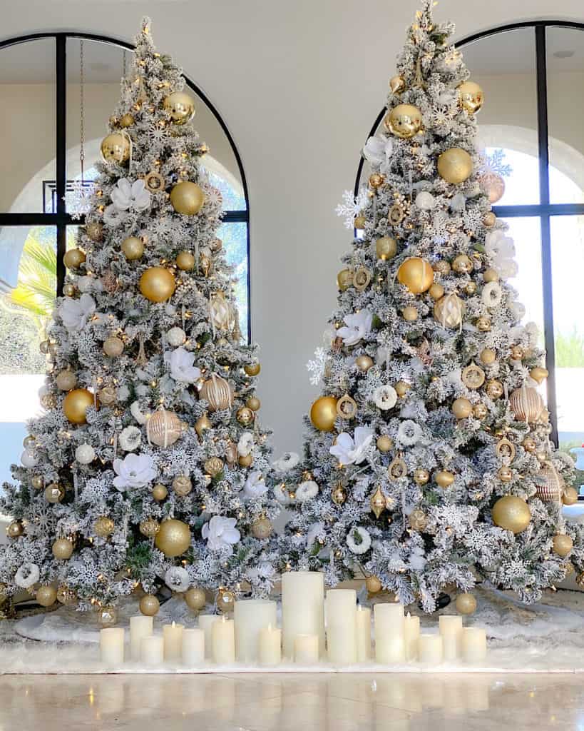 Two White and Gold Christmas trees side by side