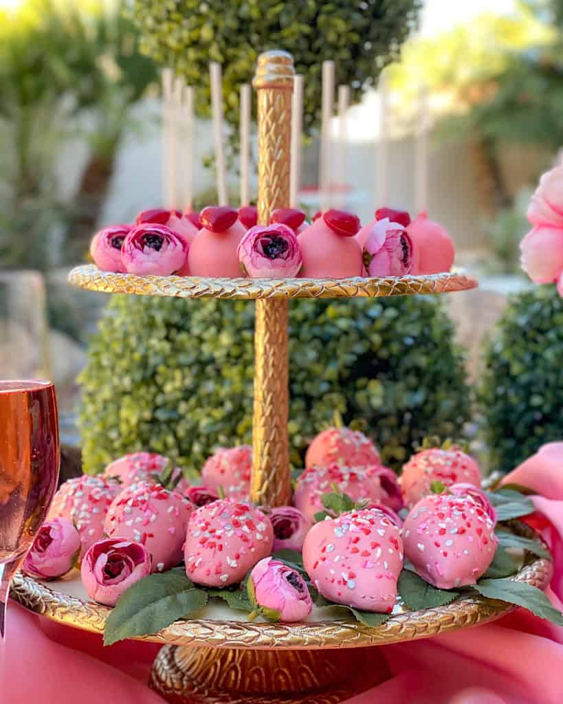 Gold Valentine's Day Cake stand with pink desserts 