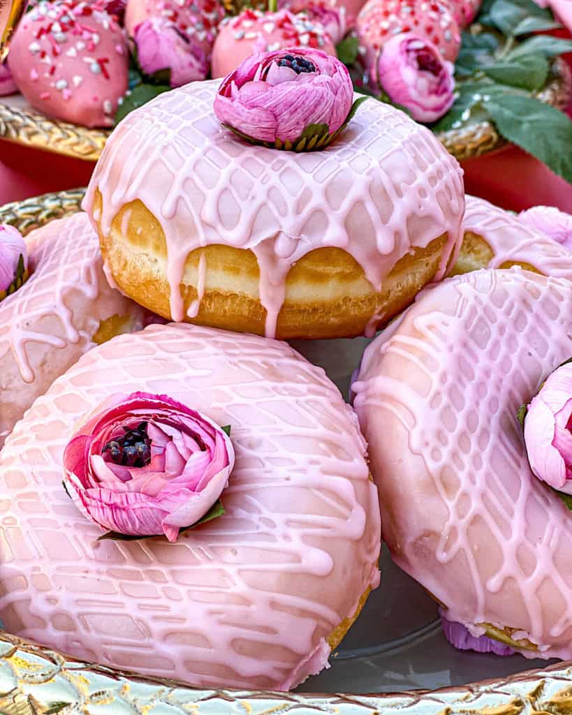 Valentine’s Day Dessert Table with donuts and flowers