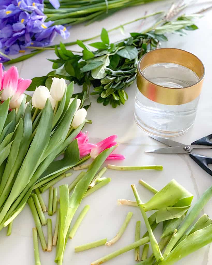 Fresh cut flowers, vase, scissors