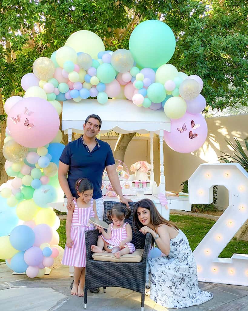 Family portrait beside ice cream cart