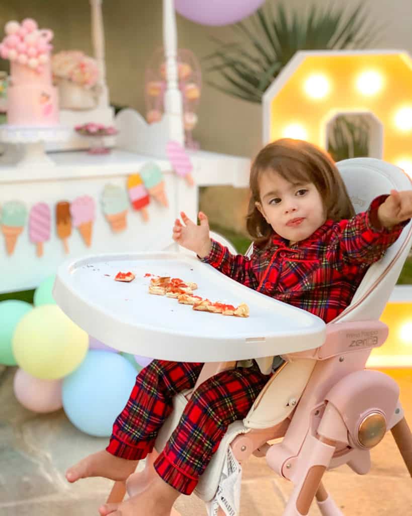 2 year old girl in pyjamas at birthday party