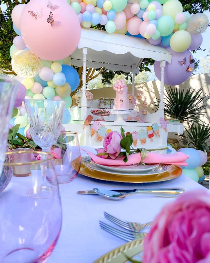 Place settings and tablescape at ice cream themed birthday party. 