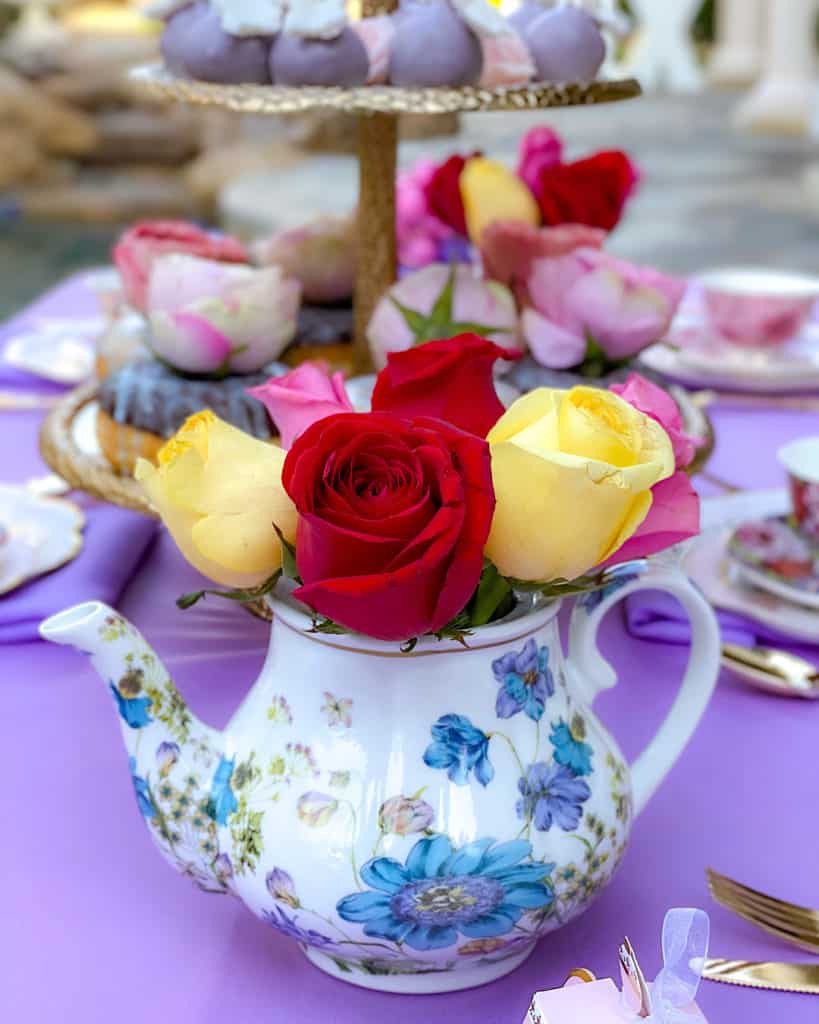 Roses in a teapot centrepiece at a Garden Tea Party themed birthday party