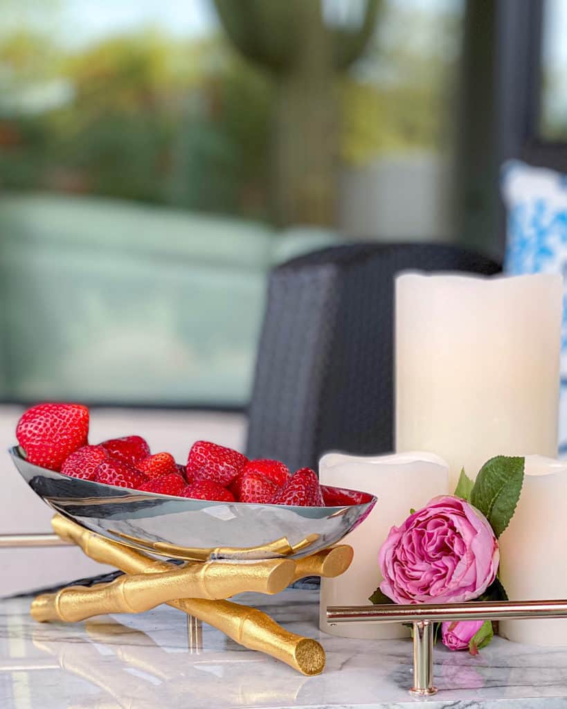 Strawberries in a bowl and camelia display: gender reveal party decor