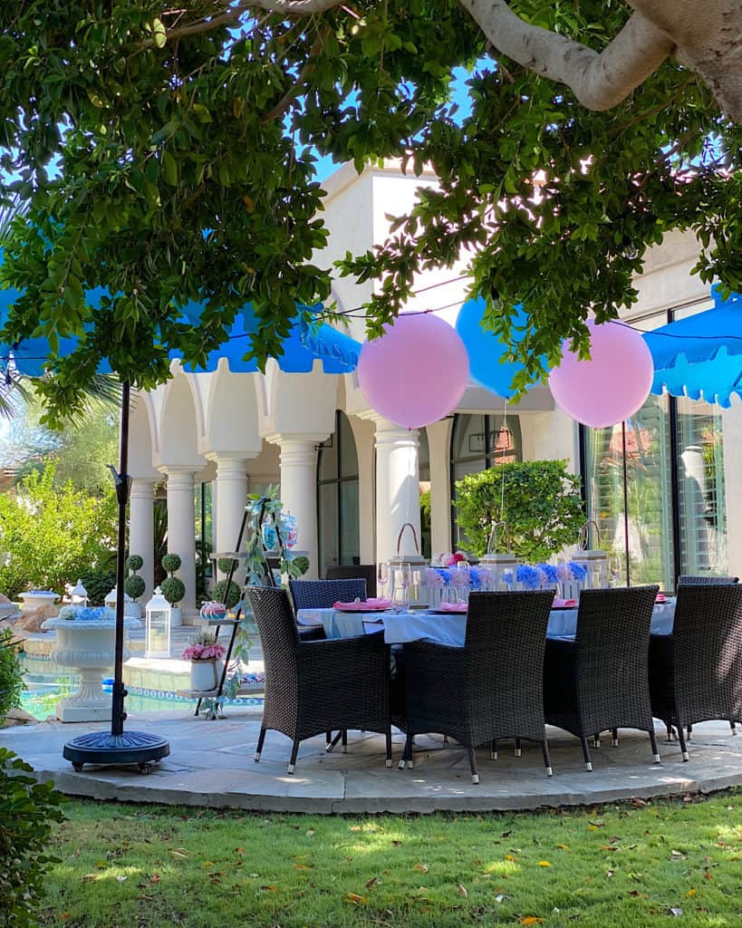 Pink and blue balloons at a garden party