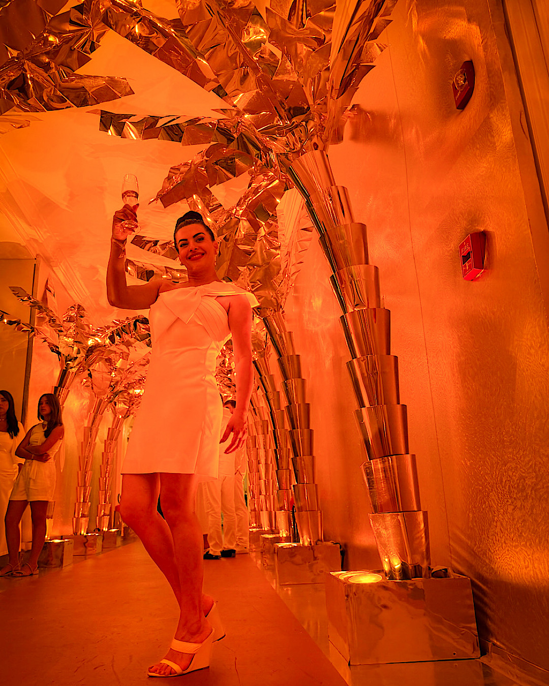Champagne toast in a gold tunnel on New Year's Eve in Rio